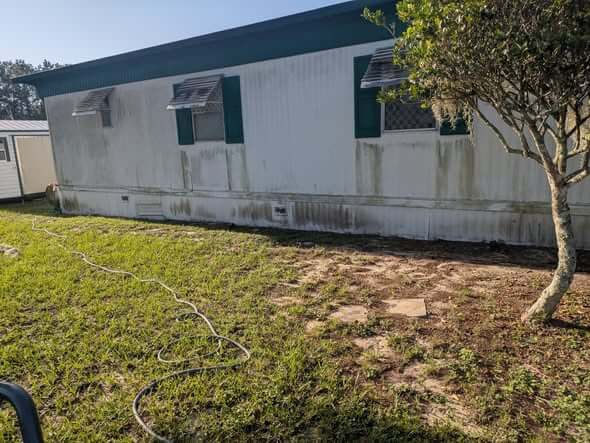 House siding before pressure washing